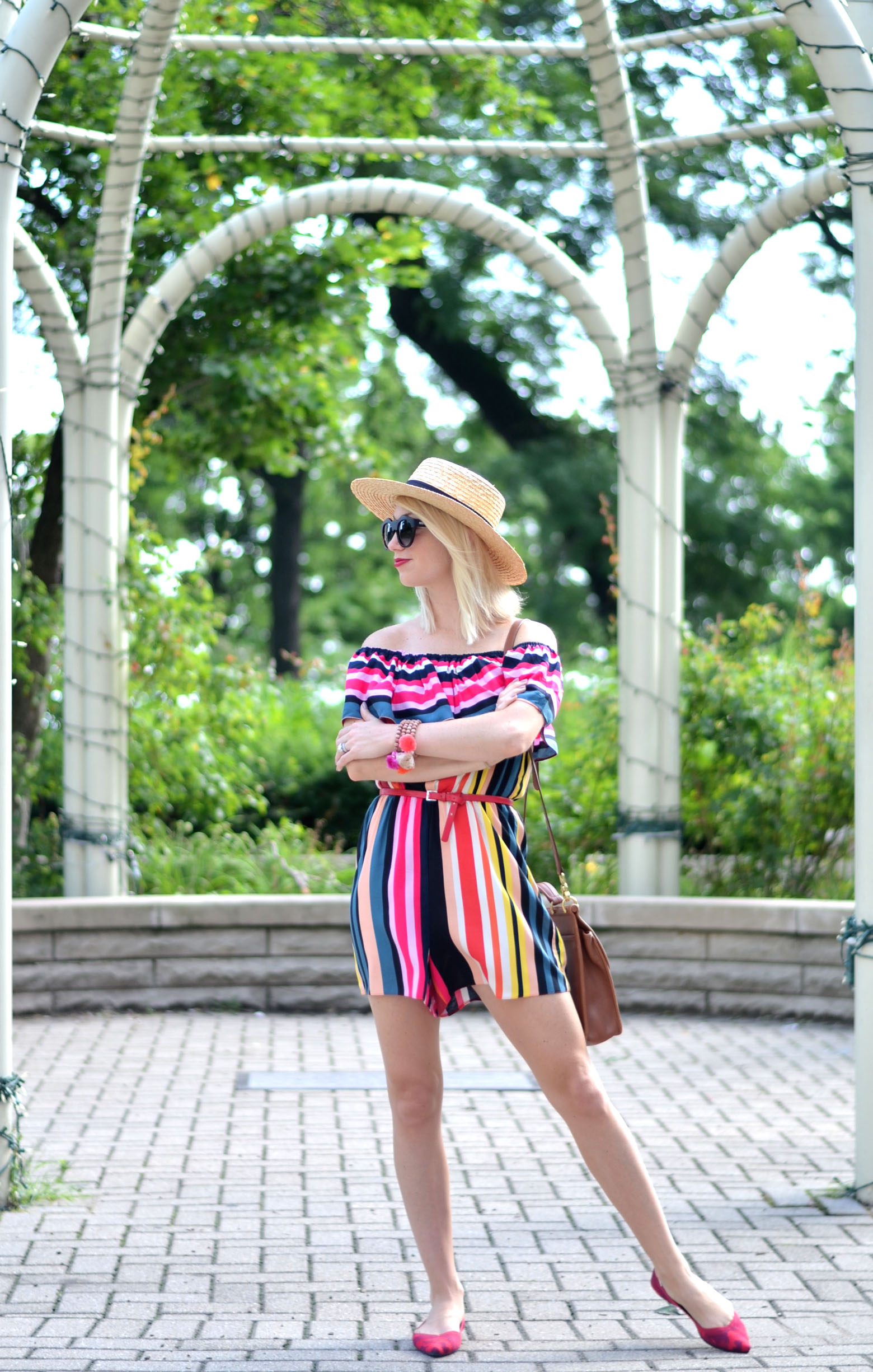 stefanie schoen of the style safari wears red camo seemless knit Rothys flats and Striped ASOS romper