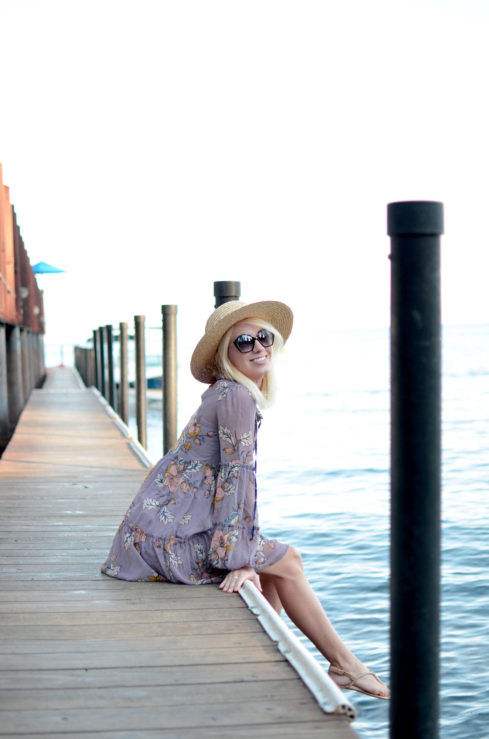 Stefanie Schoen of The Style Safari wears Target Lilac floral tiered dress, flat brim straw hat, summer style