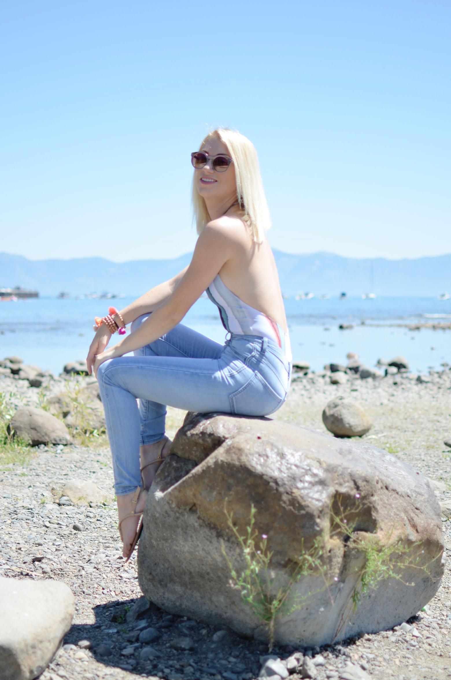 Stefanie of The Style Safari wear sunset stripe H&M bathing suit, high waist skinny jeans