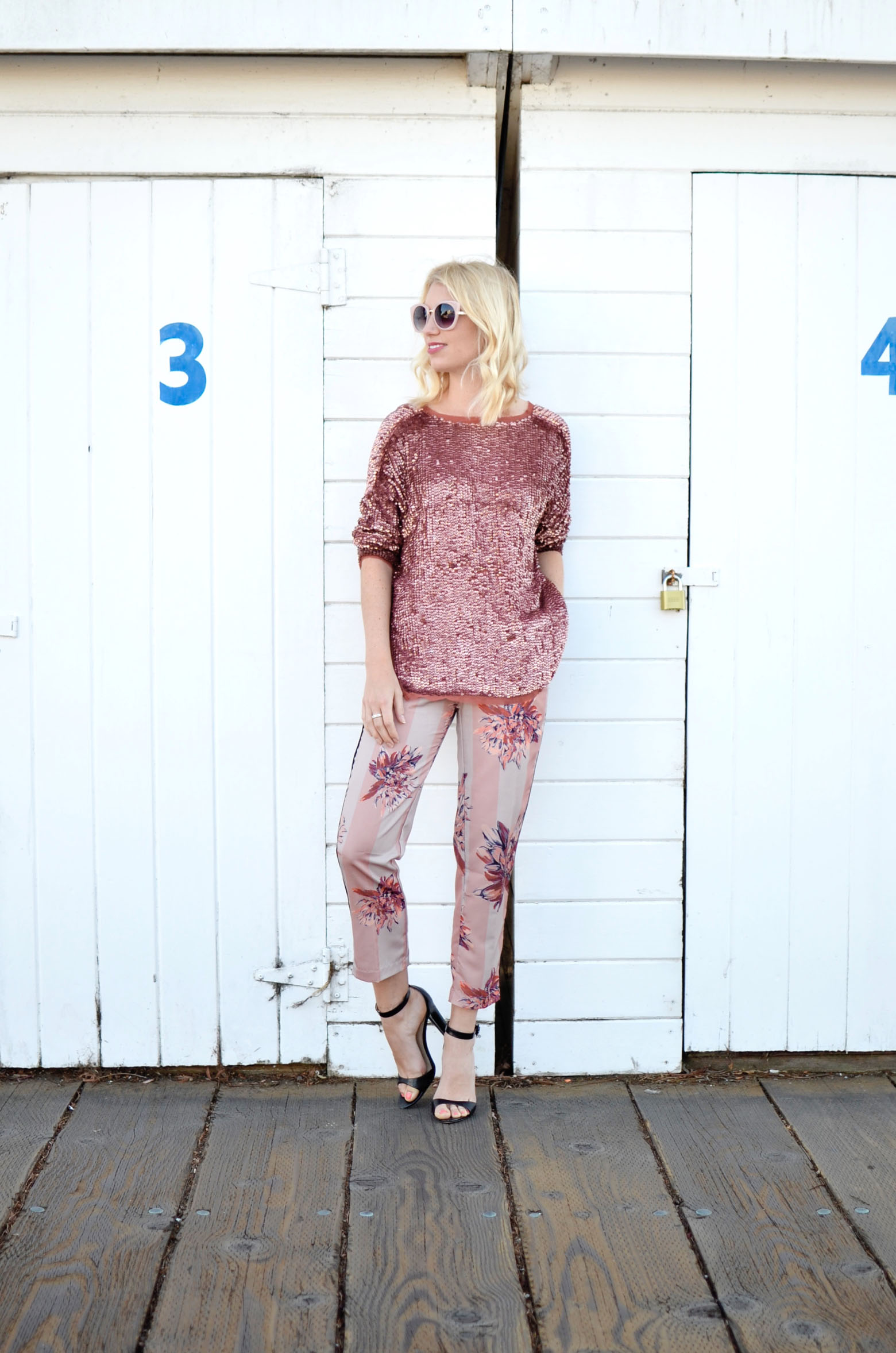 Stefanie from The Style Safari in pajama dressing, pink sequin sweater, pink floral silk pants, pink sunglasses, head to toe pink outfit // thestylesafari.com