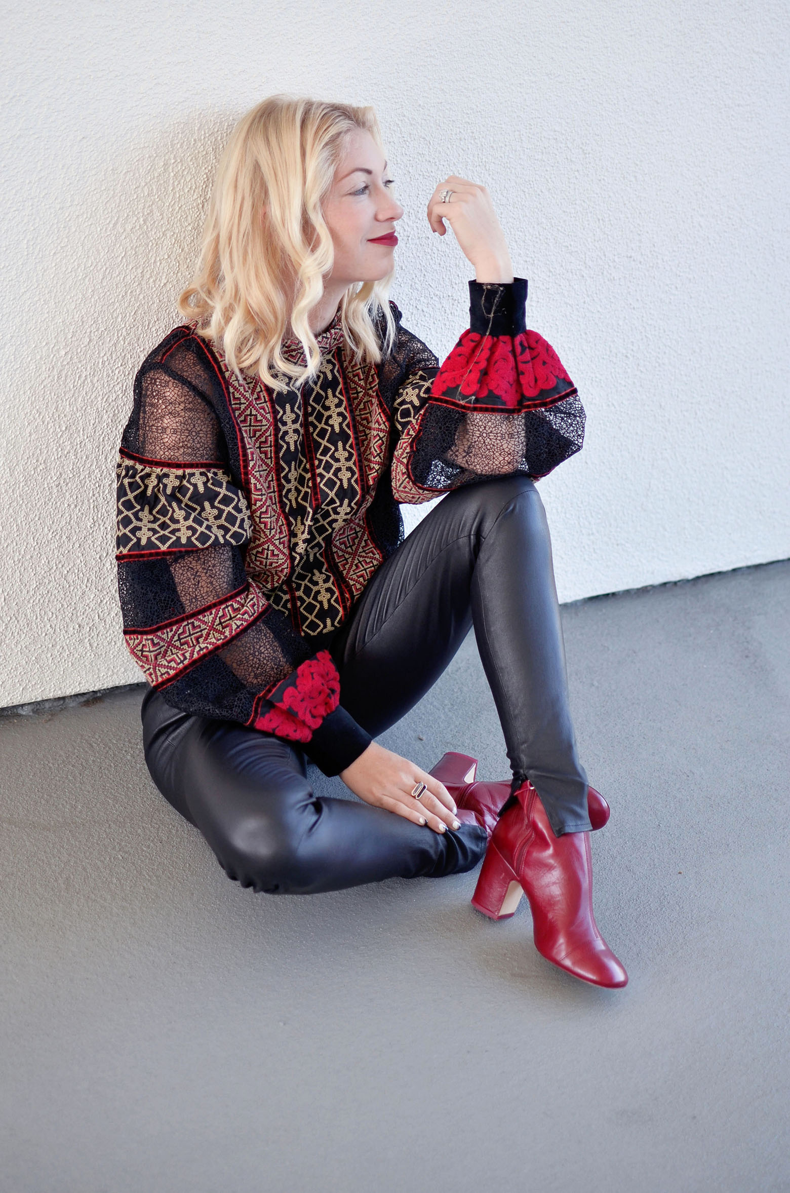 Stefanie from the style safari wears H&M Studio red black lace mesh insert top, Iris and Ink leather leggings // thestylesafari.com