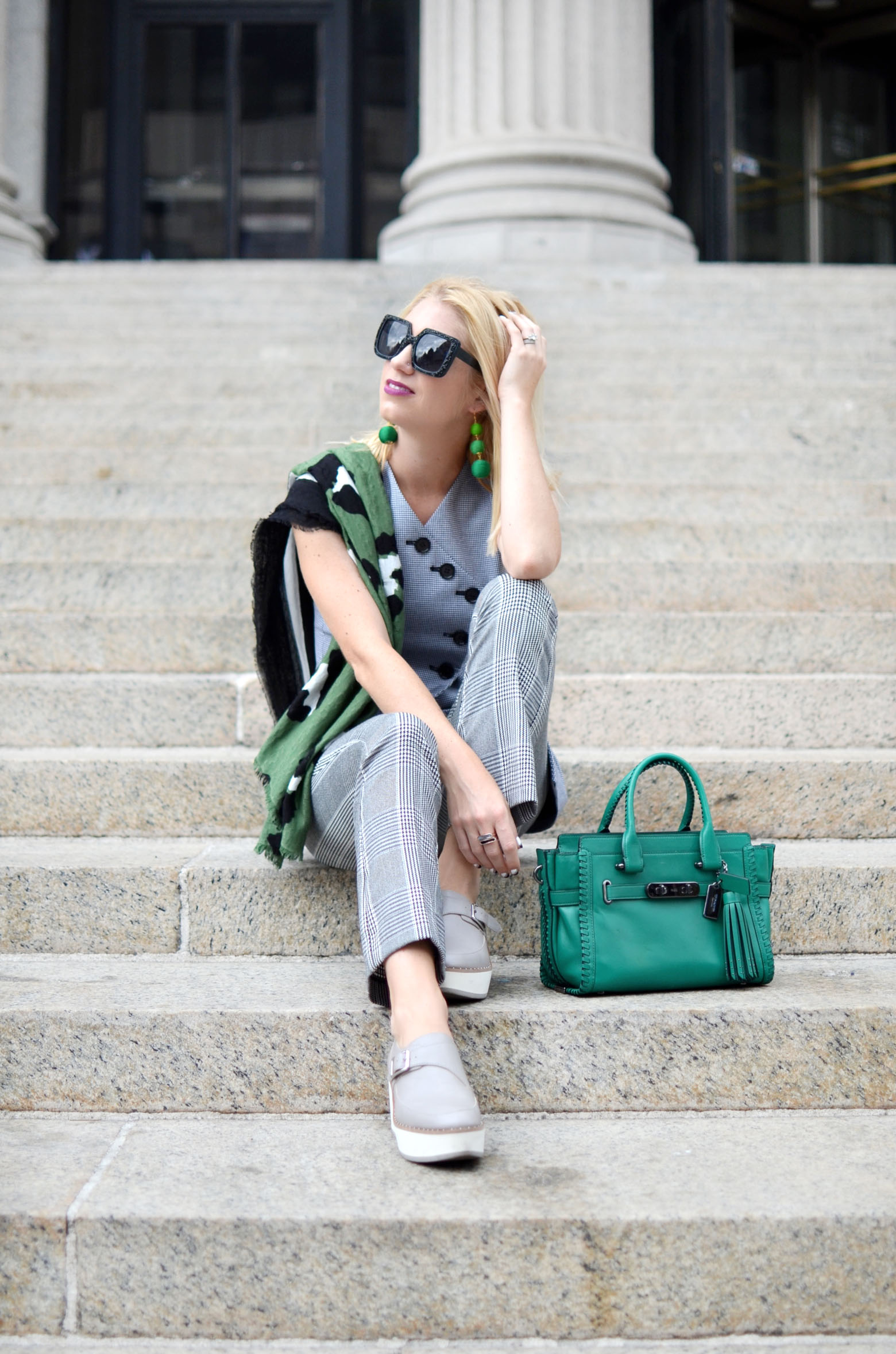 Stefanie of The Style Safari wears the menswear trend for fall, plaid suiting, green rip and repair coach swagger // thestylesafari.com
