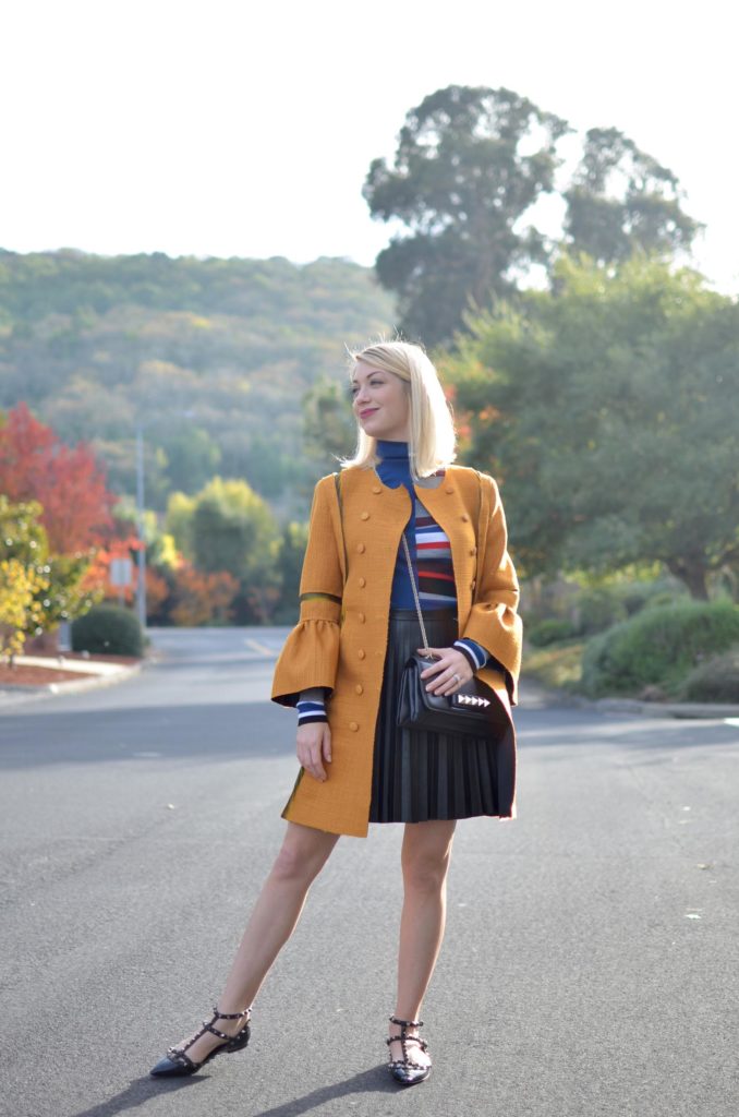 mustard yellow coat, kenzo striped turtleneck, black faux leather skirt, valentino rockstud flats // thestylesafari.com