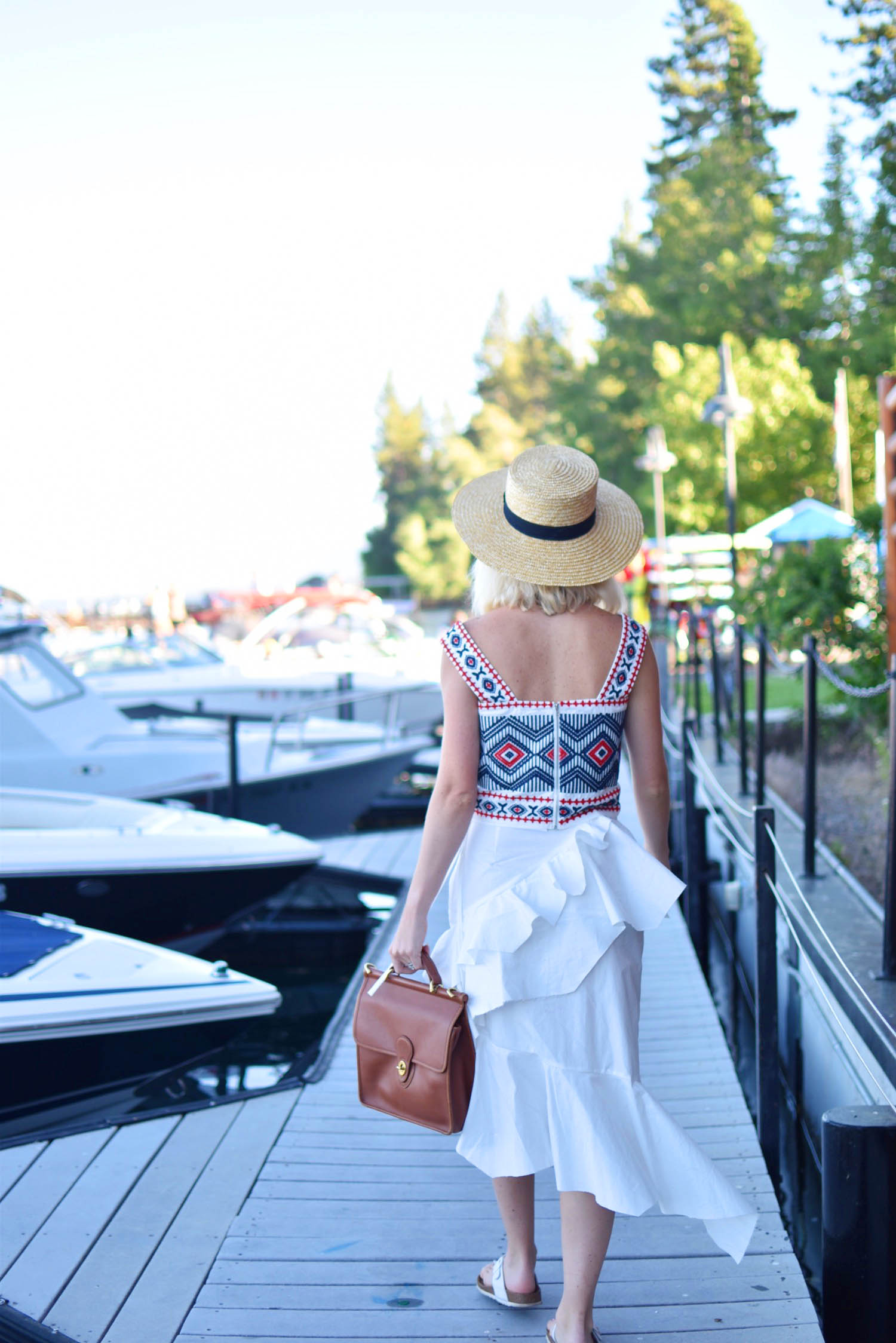 two ways to style an embroidered tank top, white ruffled skirt