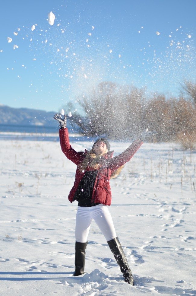 Red check puffer coat, white jeans, black boots, snow outfit // thestylesafari.com