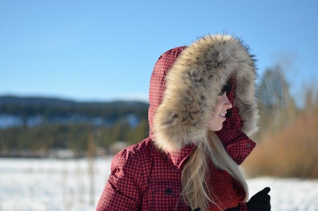 Red check puffer coat, white jeans, black boots, snow outfit // thestylesafari.com