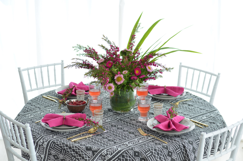 african mudcloth table cloth, table setting, pink, fuchsia, gold, crate & barrel marin dinnerware // thestylesafari.com