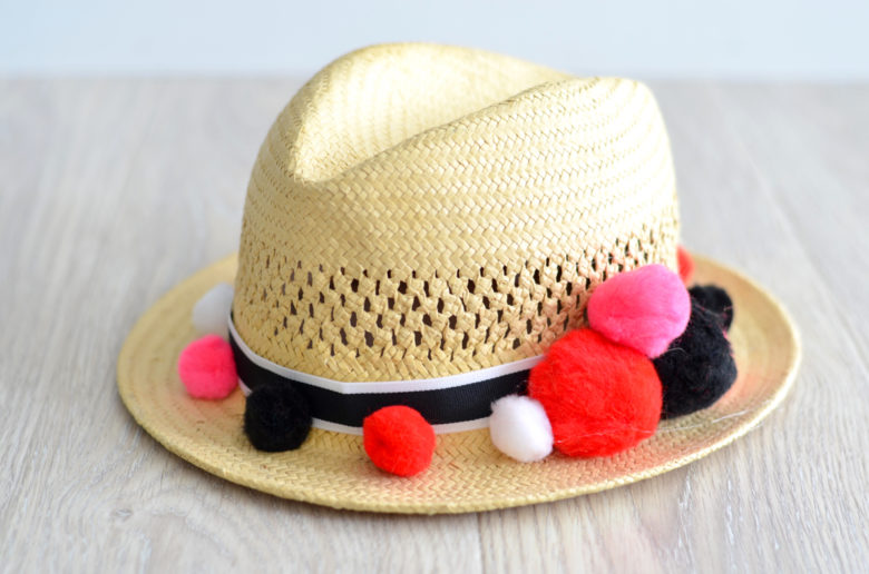 DIY pom pom straw hat // thestylesafari.com