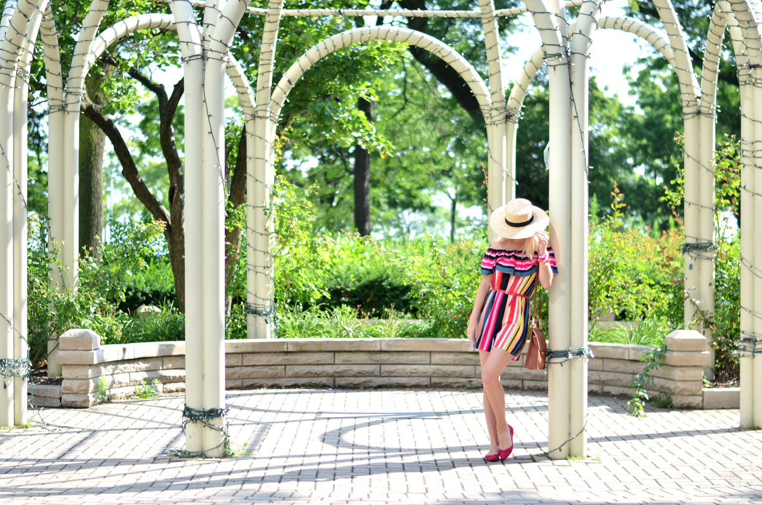 stefanie schoen of the style safari wears red camo seemless knit Rothys flats and Striped ASOS romper