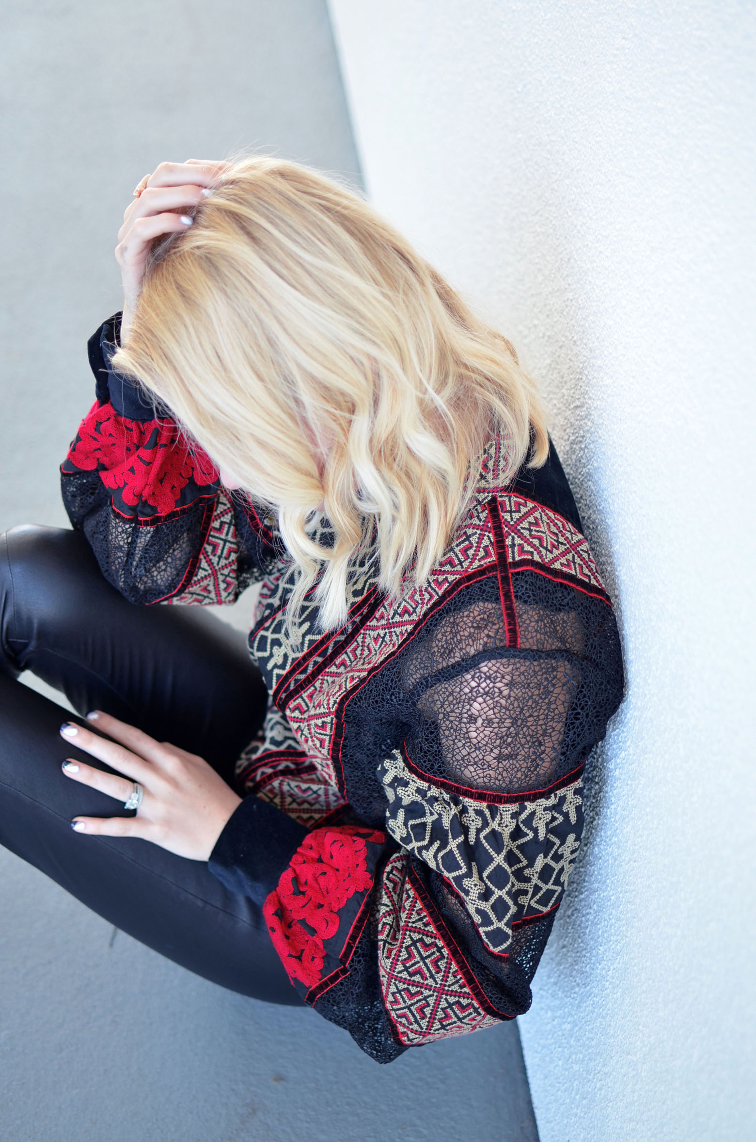 Stefanie from the style safari wears H&M Studio red black lace mesh insert top, Iris and Ink leather leggings // thestylesafari.com