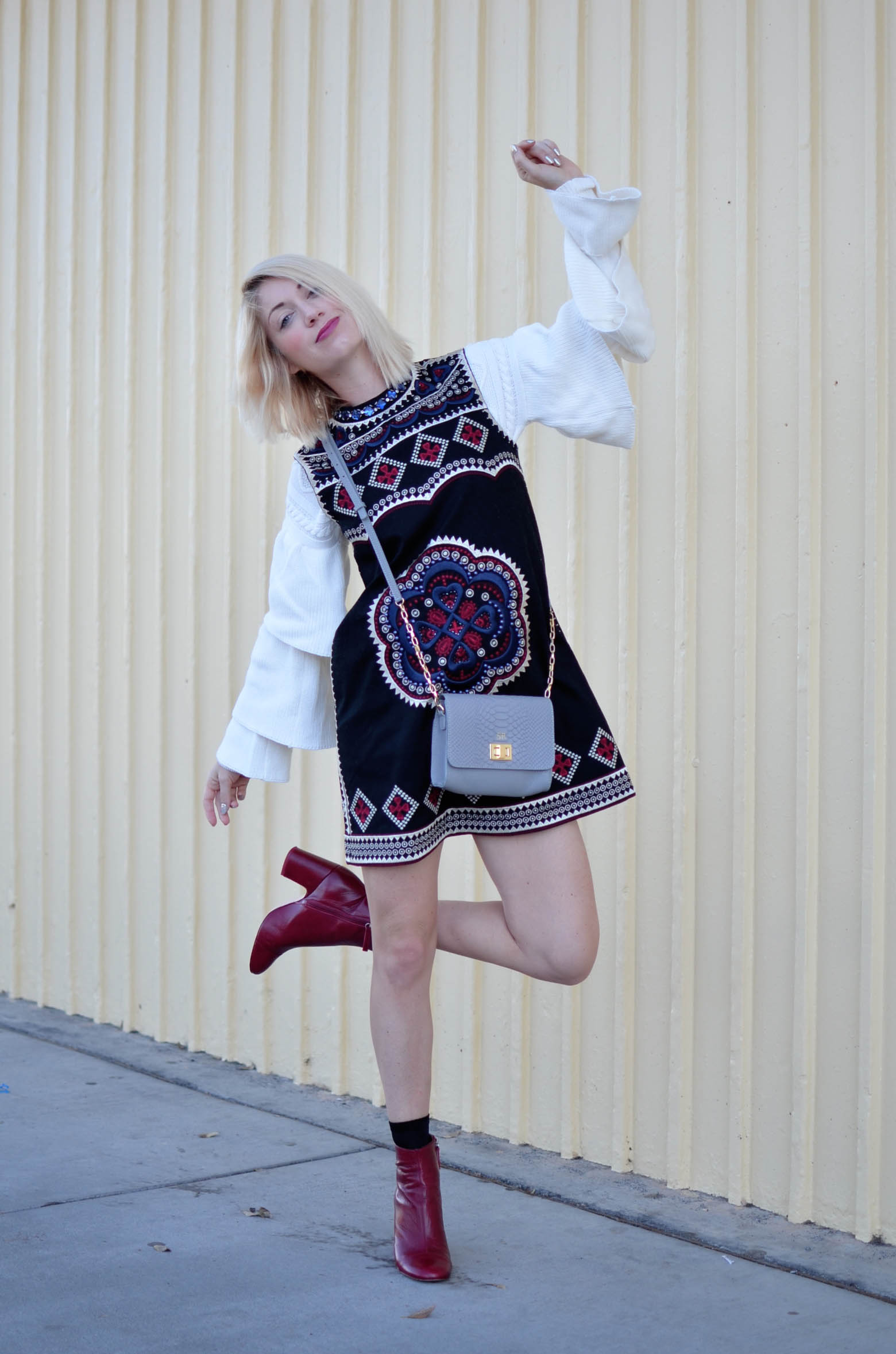 embellished shift dress, very tiered cable knit sweater, red boots, gigi new york grey cross body bag