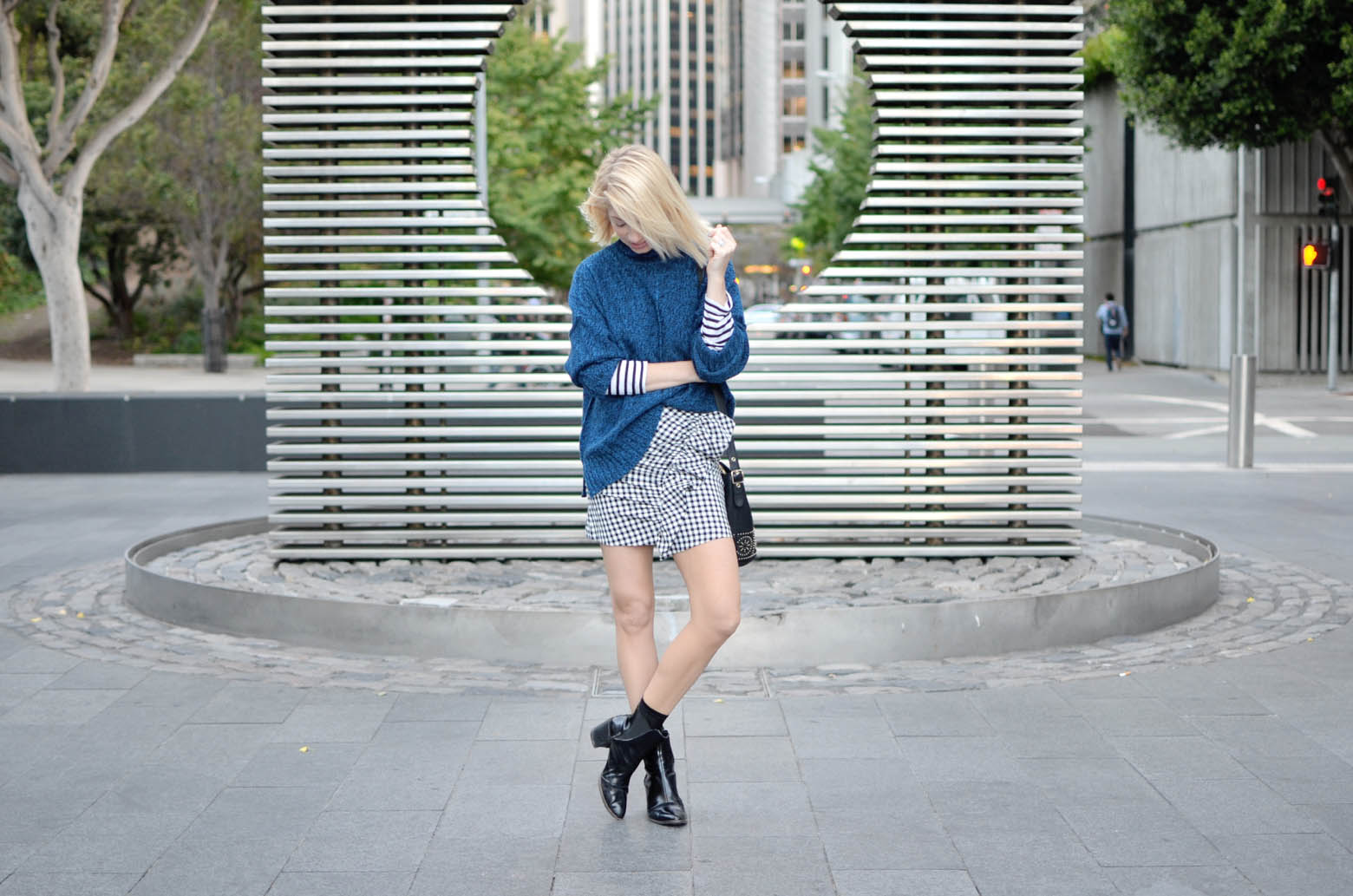 what to wear for the best pasta in san francisco, gingham ruffle mini skirt, blue oversize sweater, striped long sleeve tee, casual city street style // thestylesafari.com