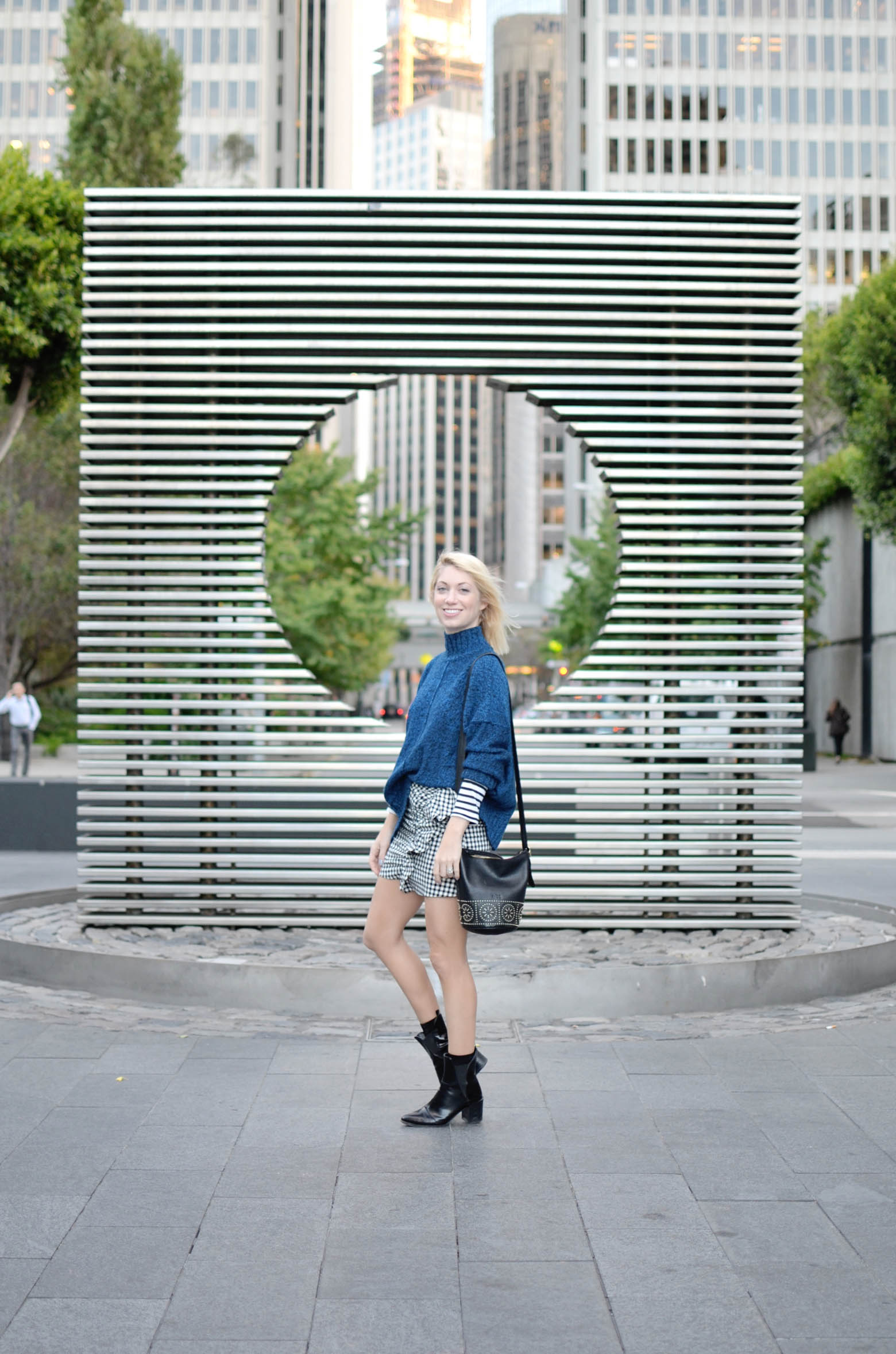 what to wear for the best pasta in san francisco, gingham ruffle mini skirt, blue oversize sweater, striped long sleeve tee, casual city street style // thestylesafari.com