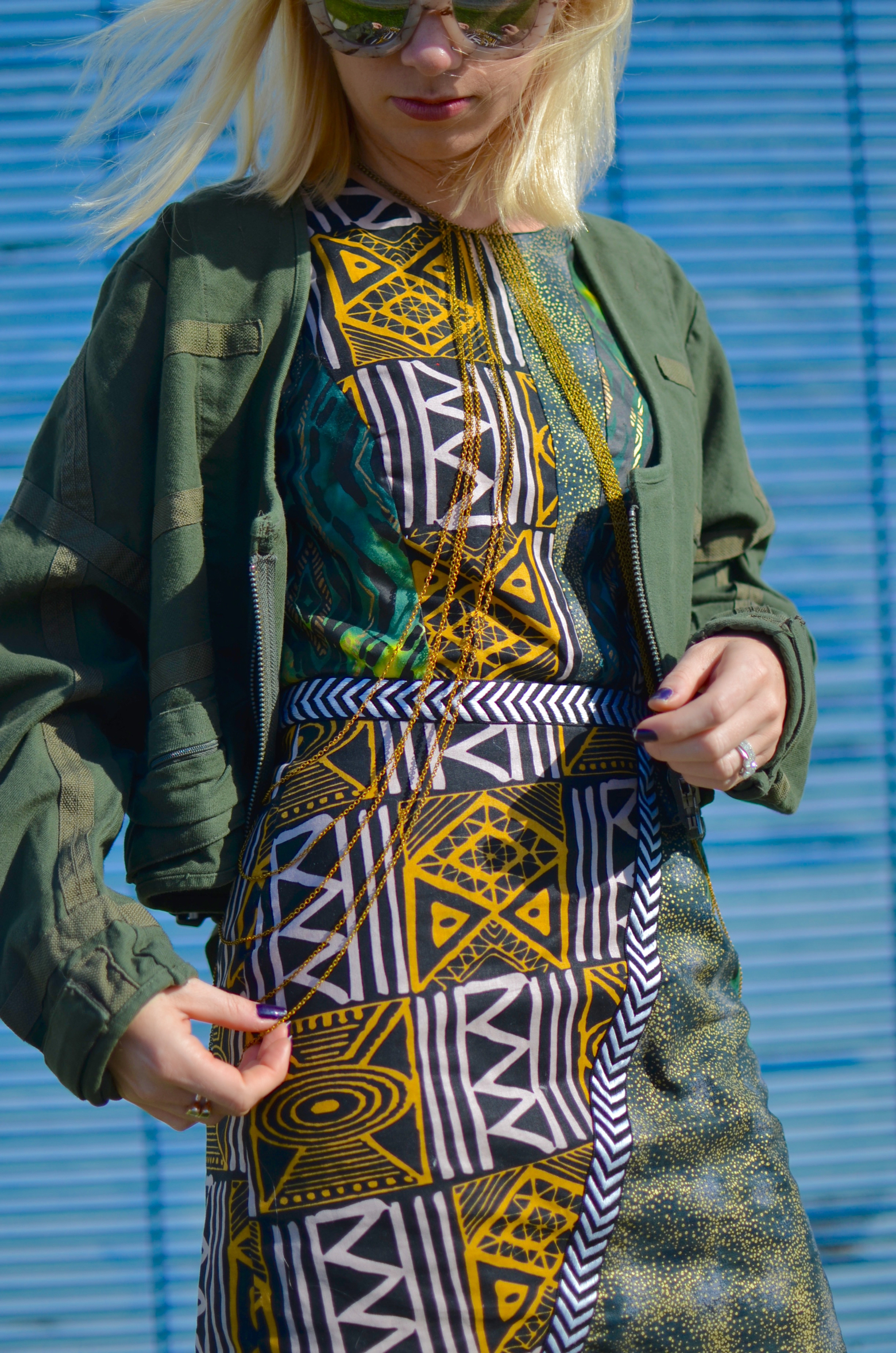 mixed print african dress, army green parachute jacket, gold body chain // thestylesafari.com