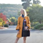 mustard yellow coat, kenzo striped turtleneck, black faux leather skirt, valentino rockstud flats // thestylesafari.com