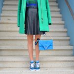 emerald green and bright blue outfit, kelly green coat, pleated faux leather black skirt, blue suede shoulder bag, snakeskin sneakers // thestylesafari.com