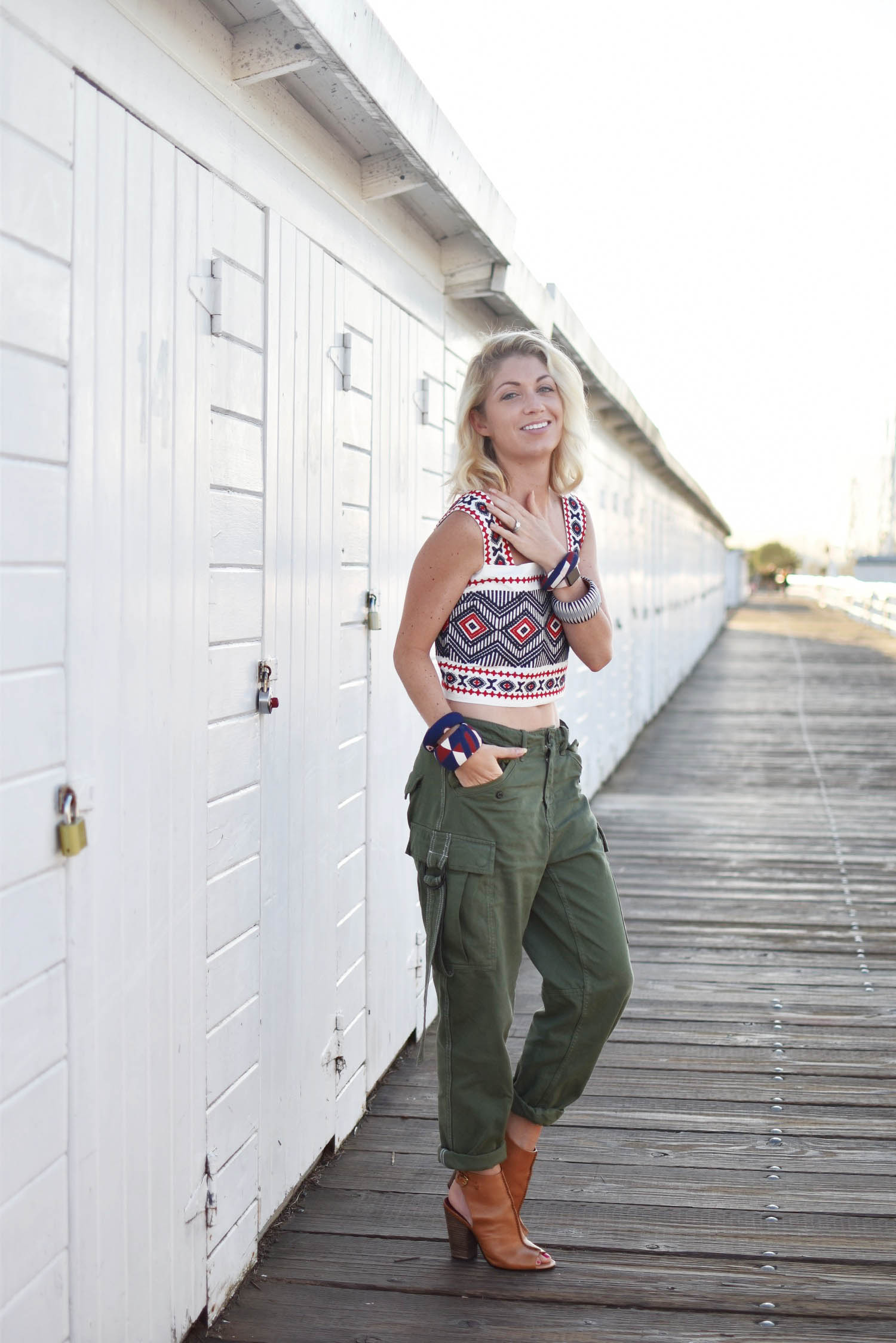 green cargo pants, embroidered white tank top