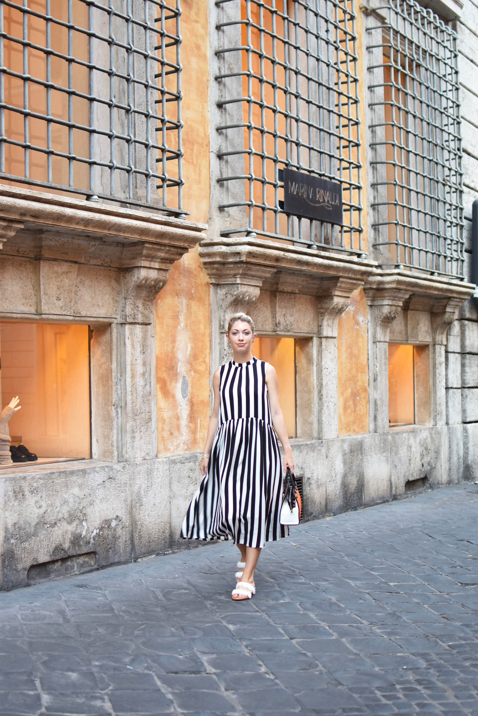 black and white striped dress and orange italian leather bag in Rome