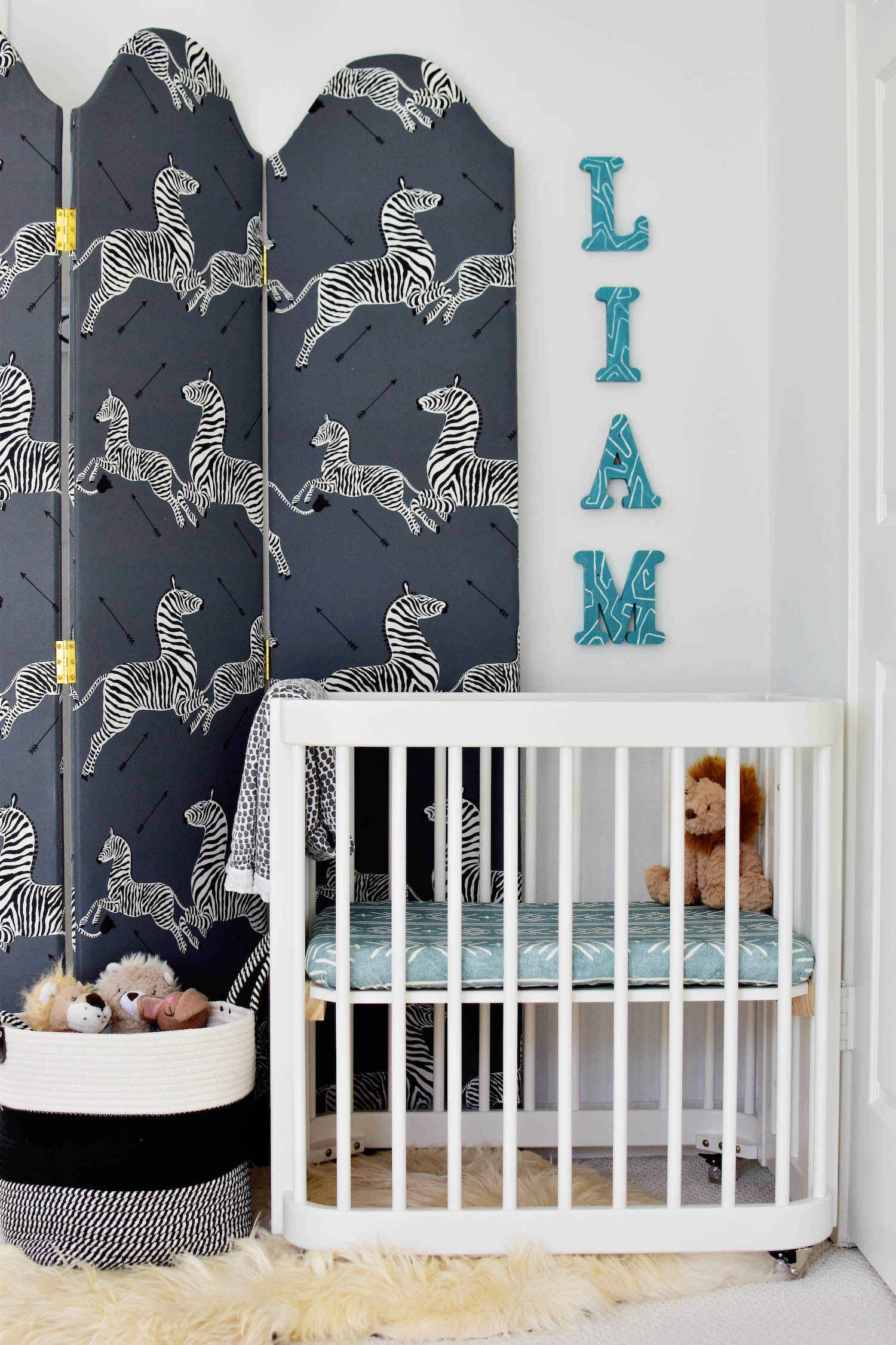 Liam's master bedroom nursery nook, covertible Nestig wave crib, TheInside scalamandre upholstered screen 3